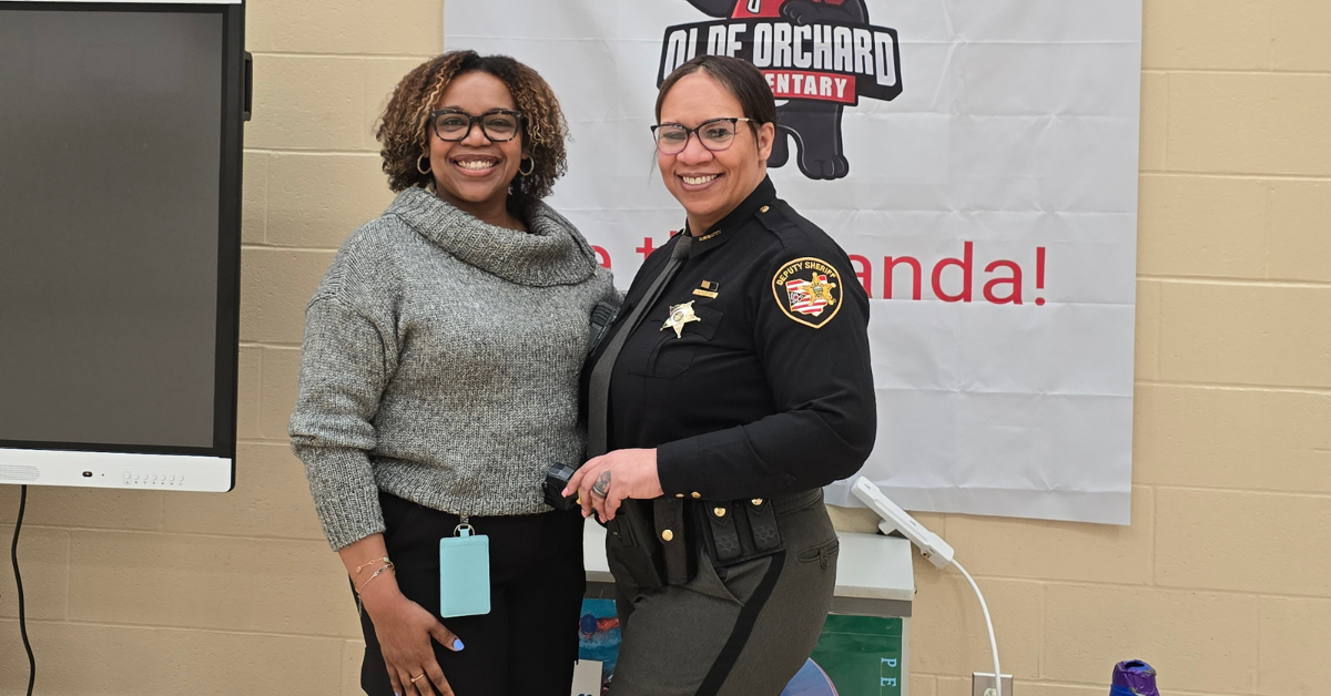 teacher posing with sherriff